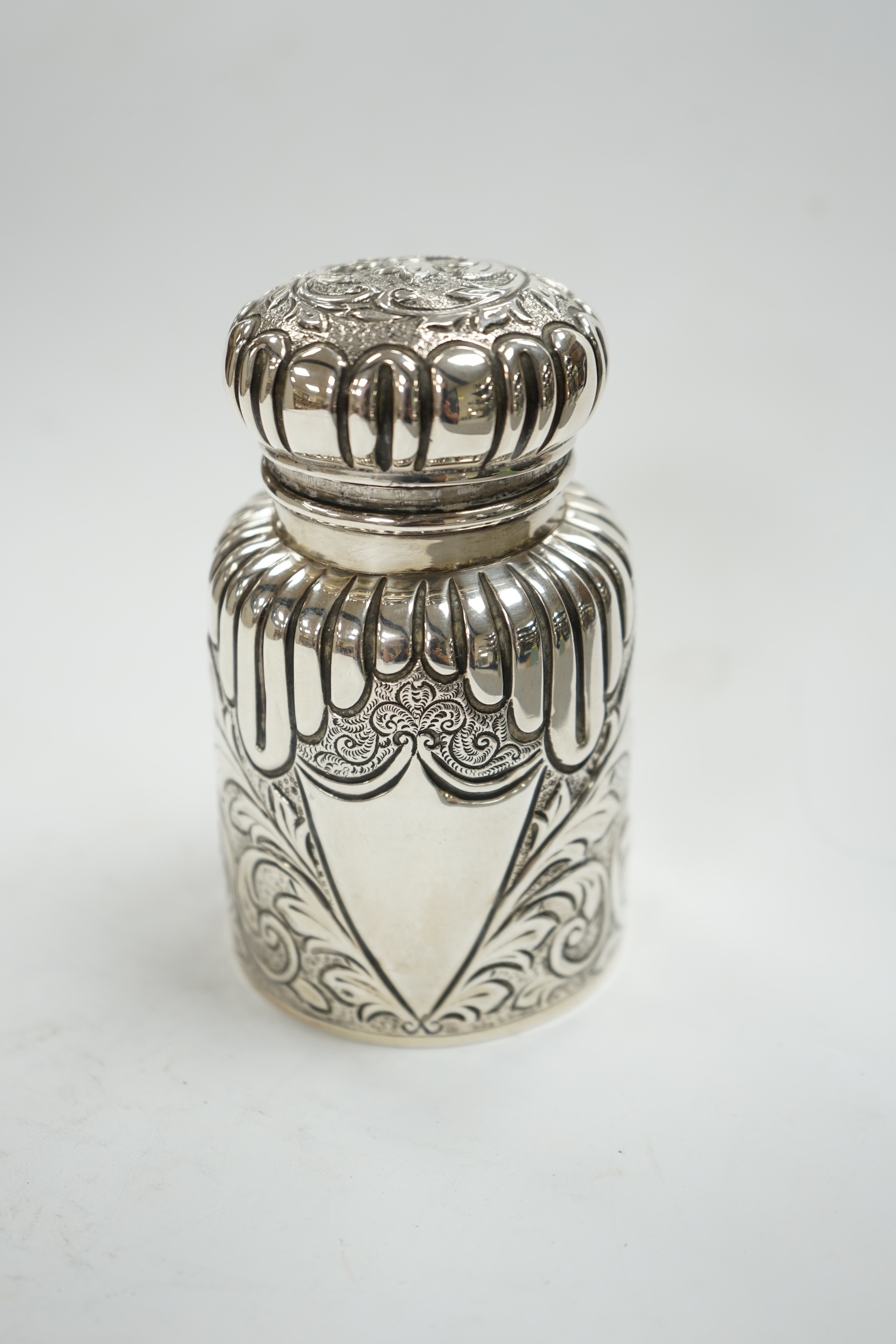 A late Victorian embossed silver scent bottle, by Arthur Wilmore Pennington, Birmingham, 1890, 95mm. Condition - poor to fair